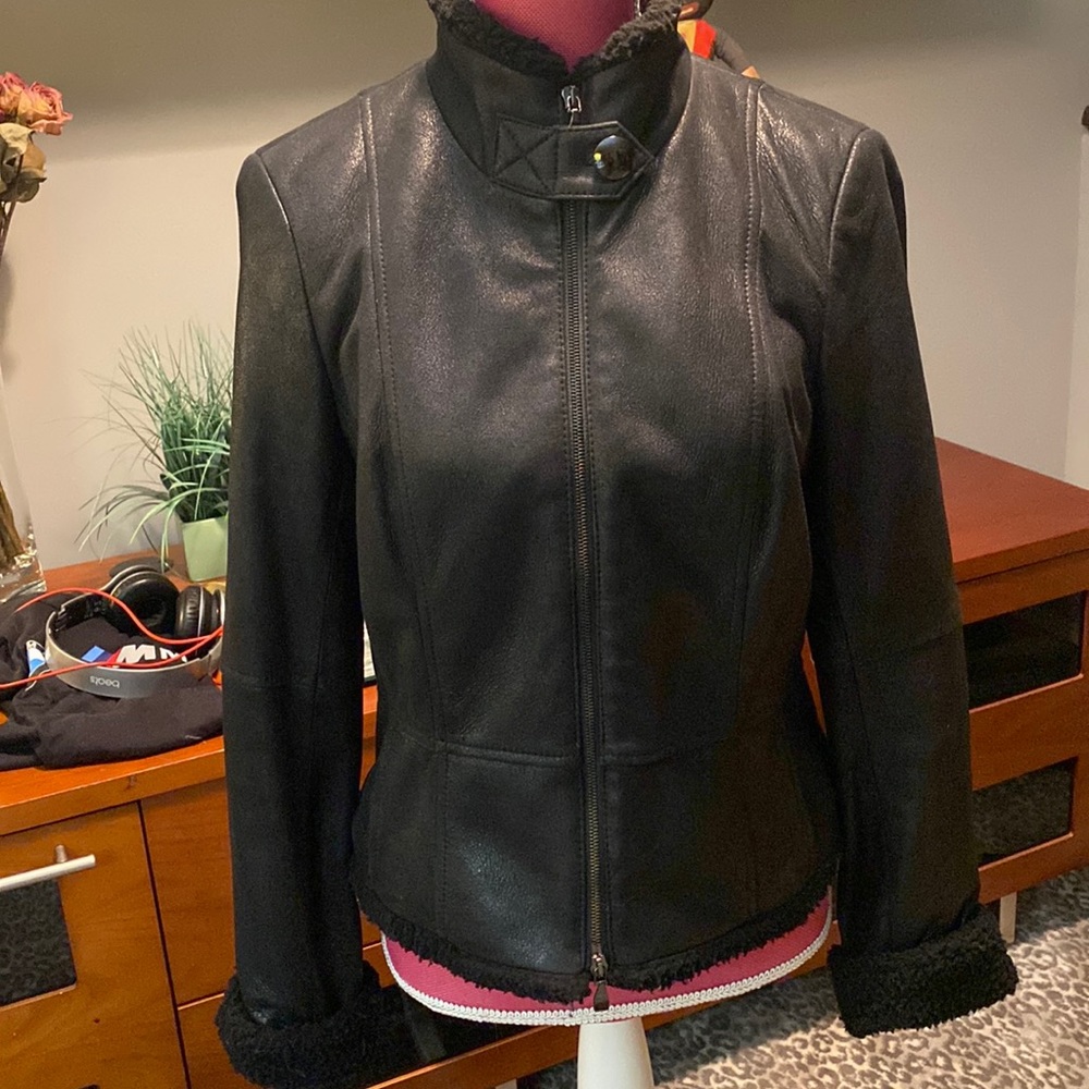 Genuine leather jacket with lambswool style trim on the collar, hem & cuffs.